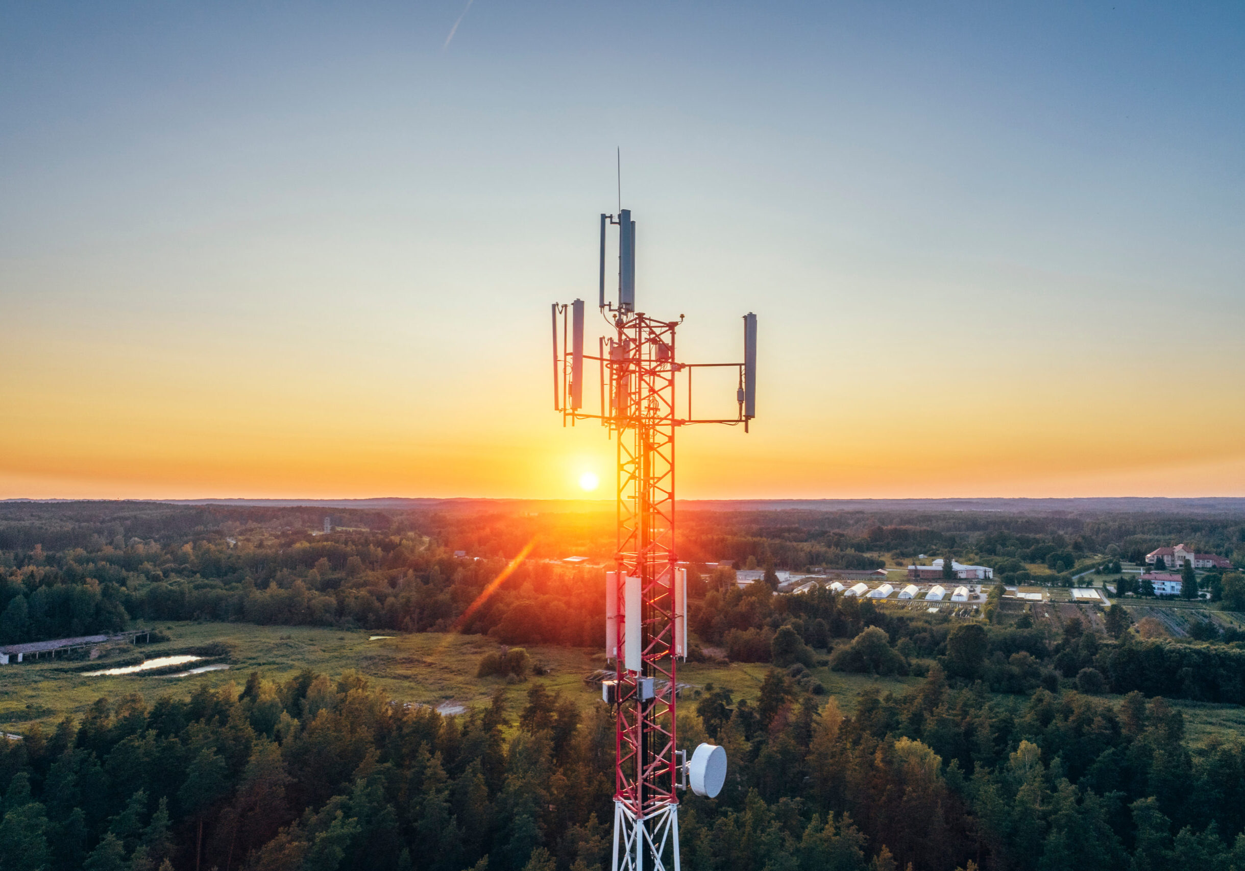 Mobile communication tower during sunset from above. Mobile communication tower during sunset from above.
